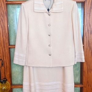 St John knit suit size 10 with embellishment on buttons, hem, collar and sleeve.